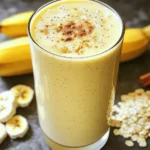 - 1 ripe banana - 1/2 cup rolled oats - 1 cup almond milk - 1 scoop vanilla protein powder - 1 tablespoon almond butter - Optional: honey or maple syrup - Optional: ground cinnamon and ice cubes Gathering the right ingredients is key for a great Protein Banana Oat Smoothie. Start with a ripe banana. The riper, the sweeter! Next, grab rolled oats. They add fiber and make your smoothie filling. Almond milk is a great choice for a creamy base. You can use regular milk if you prefer. Then, include one scoop of vanilla protein powder. This boosts the protein and flavor. Add a tablespoon of almond butter for healthy fats and richness. If you like it sweeter, consider honey or maple syrup. You can also sprinkle in ground cinnamon for warmth. Lastly, ice cubes can make your smoothie cool and refreshing. By using these ingredients, you create a tasty and nutritious drink. Each ingredient plays a role in making your smoothie not just delicious, but also healthy. - Peel and chunk the banana. Peeling is easy; just remove the skin. Cut the banana into small pieces. This helps it blend well. - Add all ingredients to the blender. Put the banana chunks, rolled oats, almond milk, and protein powder in the blender. Also, add almond butter, honey, and cinnamon. - Blend until smooth. Turn on the blender. Blend on high speed for about 30 seconds. Stop when the mixture is creamy and smooth. - Taste and add sweeteners if needed. Take a small sip of your smoothie. If it needs more sweetness, add honey or maple syrup. Blend for just a few seconds more. - Incorporate ice for chill and texture. If you like a cold drink, add ice cubes. Blend again until the ice is crushed. This will give your smoothie a nice chill. When picking a protein powder, go for a quality brand. Whey protein is popular. It blends well and tastes great. If you prefer plant-based options, choose pea protein. Soy protein is also a good choice. Both types work well in smoothies. To make this smoothie more filling, add extras. A tablespoon of chia seeds boosts fiber. You can also mix in spinach for extra vitamins. If you want healthy fats, add a quarter of an avocado. These additions will help keep you full longer. If you have leftover smoothie, store it in the fridge. Use a sealed container to keep it fresh. When you're ready to drink it, re-blend the smoothie for a smooth texture. If it's too thick, add a splash of almond milk to thin it out. {{image_4}} You can use many milk options for this smoothie. Almond milk is my go-to choice. However, you can also try coconut milk or soy milk. Each milk gives a different taste. For nut butter, almond butter works great, but peanut butter is tasty too. Sunflower seed butter is a good nut-free choice. This way, you can enjoy the smoothie, no matter your diet. To jazz up your smoothie, think about adding more fruits. Berries like strawberries or blueberries blend well with bananas. You can also add mango for a tropical twist. If you want spice, sprinkle in some nutmeg or add a dash of vanilla extract. These small changes can make your smoothie even more exciting. Need more protein? You can add seeds like chia or flaxseed. They blend in well and pack a nutritional punch. Greek yogurt is another option for a creamy boost. If you prefer, you can add another scoop of protein powder. These additions make the smoothie filling and keep you energized all day. You can keep your smoothie in the fridge for up to 24 hours. Use an airtight container for best results. This helps maintain freshness and flavor. If you notice separation, just give it a good shake before drinking. To freeze your smoothie, pour it into freezer-safe containers. Leave some space at the top, as liquids expand when frozen. It can last up to three months in the freezer. When you're ready to enjoy it, let it thaw in the fridge overnight. You can also blend in a few ice cubes for a quick chill. This smoothie is quite healthy. It packs a lot of nutrients. The ripe banana gives you potassium, which helps your heart. Rolled oats add fiber, keeping you full longer. Almond milk is low in calories and has healthy fats. Protein powder boosts your muscle health. Almond butter adds more healthy fats and protein. Ground cinnamon can help with blood sugar levels. Together, these ingredients make a balanced meal or snack. Yes, you can skip the protein powder. Try adding Greek yogurt instead. It has a lot of protein and creaminess. Cottage cheese is another great option. Both will make your smoothie thick and smooth. You can also use nut butters like peanut or sunflower butter. These will add protein and flavor too. You can add a few things for more flavor. Try berries like strawberries or blueberries. They add sweetness and color. A splash of vanilla extract can make it taste even better. You can also add a dash of nutmeg for warmth. If you like a bit of zing, try some ginger. All these options keep it healthy without extra sugar. This blog post covered how to make a Protein Banana Oat Smoothie. You learned about the key ingredients, like ripe bananas and almond milk, along with step-by-step instructions. We explored tips for choosing protein powder and storing leftovers. I shared fun variations to suit your taste and even answered common questions about health benefits. Now, you have a simple, tasty way to fuel your day. Enjoy this nutritious drink as part of your routine!