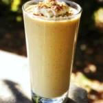 - 1 cup unsweetened almond milk - 1 ripe banana - 1 scoop vanilla whey protein powder - 1 tablespoon almond butter - 1 teaspoon ground cinnamon - 1/2 teaspoon pure vanilla extract - 1 tablespoon maple syrup (optional, to taste) - 1/4 cup rolled oats - Ice cubes (to achieve desired thickness) Each ingredient in the High Protein Snickerdoodle Smoothie plays a key role. - Almond Milk: This keeps the smoothie light and dairy-free. - Banana: It adds natural sweetness and creaminess. - Whey Protein Powder: This is the star for protein. It helps build and repair muscles. - Almond Butter: This gives a rich flavor and adds healthy fats. - Cinnamon: This spice offers warmth and enhances the snickerdoodle taste. - Vanilla Extract: It provides a sweet aroma and depth of flavor. - Maple Syrup: This is optional but gives a touch of sweetness if you want it. - Rolled Oats: These add fiber and make the smoothie filling. - Ice Cubes: These help achieve the perfect thickness. Choosing good-quality ingredients makes a difference. Here are some suggestions: - Almond Milk: Look for brands with no added sugar, such as Califia Farms or Silk. - Whey Protein Powder: Opt for brands like Optimum Nutrition or Quest for quality. - Almond Butter: Try brands like Justin's or MaraNatha, known for their pure nut butters. - Maple Syrup: Use pure maple syrup for the best flavor, like Grade A or B. - Rolled Oats: Choose certified gluten-free oats if needed, like Bob's Red Mill. Feel free to swap out the almond butter for peanut butter if you prefer. First, grab your blender. I recommend a high-speed blender for this smoothie. It helps mix everything well. Start by pouring in 1 cup of unsweetened almond milk. This is your base. Next, peel and break the ripe banana into chunks. Add it to the blender. It adds natural sweetness and creaminess. Now, it’s time to add the protein. Scoop in 1 serving of vanilla whey protein powder. This boosts the protein level in your drink. Spoon in 1 tablespoon of almond butter for a nutty flavor. Don't forget the spices! Sprinkle in 1 teaspoon of ground cinnamon and 1/2 teaspoon of pure vanilla extract. If you like a sweeter taste, drizzle in 1 tablespoon of maple syrup. Toss in 1/4 cup of rolled oats for added texture. With all the ingredients in the blender, blend on high speed. Do this until you achieve a smooth and creamy mix. If your smoothie seems a bit thin, add a handful of ice cubes. Blend again until it is thick and smooth. To get the right consistency, make sure all ingredients are fresh. If you want a thicker smoothie, add more oats or ice. For a thinner smoothie, add a bit more almond milk. Always taste your smoothie before pouring it out. If it needs more sweetness, add more maple syrup and mix again. Finally, pour the smoothie into a tall glass. For a nice touch, sprinkle a pinch of cinnamon on top. Enjoy your high protein snickerdoodle smoothie! This high protein snickerdoodle smoothie packs a punch. It has about 350 calories per serving. Here’s a quick look at the macronutrients: - Protein: 25 grams - Carbohydrates: 45 grams - Fat: 10 grams - Fiber: 7 grams The protein comes mainly from the whey protein powder and almond butter. The carbs mostly come from the banana and oats. This balance makes it a great snack or quick meal. High protein smoothies offer many benefits. They help build muscle, aid in recovery, and keep you full. Here are some key points: - Sustained Energy: The protein and healthy fats give you long-lasting energy. - Muscle Repair: Protein helps repair muscles after exercise. - Nutrient-Rich: Packed with vitamins and minerals from fruits and oats. - Weight Management: High protein content can support weight loss goals. When you compare this smoothie to traditional snickerdoodle cookies, the difference is clear. A typical cookie has more sugar and fewer nutrients. Here’s how they stack up: - Calories: One cookie can have around 100 calories, while the smoothie has 350. - Protein: Cookies have little to no protein, unlike our smoothie. - Sugar: Cookies often have added sugars, while this smoothie uses natural sweetness from banana and maple syrup. Overall, this smoothie is a healthier choice, giving you the joy of snickerdoodles without the guilt. {{image_4}} To make your smoothie really creamy, use frozen bananas. These give a thick, rich texture. You can also add more almond butter. A little extra can enhance creaminess and flavor. If you like, try adding a bit of Greek yogurt. This adds protein and smoothness to your drink. Taste your smoothie before serving. If it’s not sweet enough, add more maple syrup. Start with a small amount, then blend and taste again. Remember, you can always add more, but you can’t take it out. You can also try using honey or agave syrup for a different flavor. Want to boost nutrition? Add a handful of spinach or kale. These greens blend well and don’t change the taste much. Use baby spinach for a milder flavor. You can also try adding avocado. It makes the smoothie creamy and adds healthy fats. Always blend well to keep the texture smooth. To make a vegan high protein snickerdoodle smoothie, swap the whey protein. Use a plant-based protein powder instead. Almond milk is already vegan, so keep that. Replace almond butter with peanut butter if you prefer. This keeps it creamy and delicious. You can also add a date for sweetness. Blend until smooth, and enjoy your vegan treat! Chocolate lovers can add cocoa powder to the smoothie. One tablespoon will do the trick for a rich taste. For a peanut butter twist, replace almond butter with peanut butter. This gives the smoothie a fun flavor. You can mix both cocoa and peanut butter for an indulgent treat. Just remember to adjust the sweetness if needed! If you have nut allergies, don't worry. Use sunflower seed butter instead of almond butter. This keeps the creaminess without the nuts. Swap almond milk for oat milk or coconut milk. Both options keep it tasty and smooth. You can still enjoy a high protein snickerdoodle smoothie without nuts. Yes, you can meal prep this smoothie. Just blend all the ingredients and store it in the fridge. You can keep it for up to two days. Just give it a quick shake or stir before drinking. If you want to avoid separation, blend it fresh when you can. To make your smoothie more filling, add more rolled oats or nut butter. You can also use Greek yogurt as a base for extra creaminess and protein. Chia seeds are another great option. They expand in liquid and add fiber, making your smoothie heartier. Toppings can make your smoothie extra special! Try adding a sprinkle of cinnamon, crushed nuts, or granola. You can also add a swirl of almond butter on top for extra flavor. Sliced bananas or a few chocolate chips would be delicious too. In this post, we covered how to make a high-protein snickerdoodle smoothie. We explored the right ingredients, step-by-step blending, and nutritional benefits. I also shared tips to enhance flavor and texture. Remember, you can customize this recipe to fit your diet. Experiment with flavors and find what you like best. A delicious and protein-packed smoothie can be easy and fun to make. Enjoy every sip and boost your health!