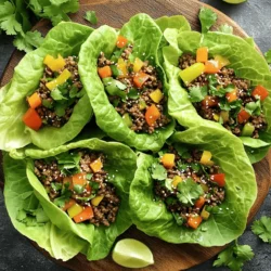- 1 lb ground beef (or ground turkey for a lighter option) - 3 tablespoons sesame oil - 4 cloves garlic, minced - 2 tablespoons soy sauce (or tamari for gluten-free) - 1 tablespoon oyster sauce (or hoisin sauce) - 1 teaspoon freshly grated ginger - 1 cup bell peppers, diced - 1 cup green onions, sliced - Fresh cilantro and lime wedges for garnish (optional) For these Sesame Garlic Beef Lettuce Wraps, you will need some key ingredients. First, choose your meat. Ground beef gives rich flavor, while ground turkey offers a lighter choice. Next, sesame oil adds a nutty taste that makes this dish shine. Don’t skip the garlic; it adds a punch of flavor. Now let’s talk about flavor enhancers. Soy sauce brings saltiness, and oyster sauce adds depth. Ginger brightens your dish with freshness. For a pop of color and crunch, use bell peppers and green onions. These veggies not only taste great but also make your wraps look pretty. Lastly, consider garnishing with fresh cilantro and lime. They add zest and make every bite special. Gather these ingredients, and you’re ready to create a fast and tasty meal! - Heat 3 tablespoons of sesame oil in a large skillet over medium-high heat. Watch for it to shimmer. - Add 4 minced cloves of garlic and 1 teaspoon of freshly grated ginger. Sauté for about 30 seconds. The aroma will be amazing! - Add 1 pound of ground beef or ground turkey to the skillet. Cook until browned, about 5 to 7 minutes. Break it apart with a spatula as you cook. - Pour in 2 tablespoons of soy sauce and 1 tablespoon of oyster sauce. Stir well to coat the meat. - Add 1 cup of diced bell peppers. Cook for another 2 to 3 minutes. The peppers should stay crunchy and colorful. - Remove the skillet from heat, then gently mix in 1 cup of sliced green onions and 1 tablespoon of toasted sesame seeds. This adds great flavor! - Take a head of butter or romaine lettuce and gently separate the leaves. - Place a generous spoonful of the beef mixture in the center of each leaf. - Top with fresh cilantro and a squeeze of lime if you like. - Carefully wrap the lettuce around the beef. Enjoy your tasty and healthy wraps right away! - Best practices for sautéing: Heat your sesame oil until it shimmers. This ensures a nice sear and helps the flavors bloom. - Timing for seasoning the beef: Add the soy sauce and oyster sauce when the beef is browned. This adds depth to the meat while keeping it juicy. - Ensuring bell peppers maintain crunch: Add the diced bell peppers last. Stir them in for just 2-3 minutes. This keeps them crisp and colorful. - Presentation tips for wraps: Serve on a stylish platter. Arrange the wraps neatly, and sprinkle extra sesame seeds for flair. - Suggested side dipping sauce: Mix soy sauce with a bit of sweet chili sauce. This adds a sweet and spicy kick that pairs well with the wraps. - Balancing flavors with additional garnishes: Fresh cilantro and lime are great. They add brightness and freshness to the rich beef. {{image_4}} You can switch out the beef in these wraps. Ground turkey or chicken works well. Both options keep the dish light but still tasty. If you want a vegan choice, try lentils or mushrooms. These options add great texture and flavor, making your wraps just as delicious. For those avoiding gluten, use tamari instead of soy sauce. It still gives you that savory kick. You can also spice things up! Add chili garlic sauce or sriracha for a hot twist. This adds a fun kick to your wraps. Feel free to get creative with your veggies. You can use carrots, cucumbers, or even jicama for extra crunch. Adding more greens, like spinach or arugula, boosts nutrition and flavor. This way, you can make the dish your own while keeping it fresh and exciting. To store leftovers, place the beef mixture in an airtight container. Let it cool to room temperature first. Seal it tightly and store it in the fridge. This keeps the beef fresh for up to three days. For best results, eat the wraps within this time frame. To maintain flavor and freshness, keep the lettuce separate. Wrap the leaves in a damp paper towel. Place them in a plastic bag or container. This helps them stay crisp and crunchy. You can freeze the beef mixture for later use. First, let it cool completely. Then, place it in a freezer-safe container. Label it with the date and contents. The beef can stay frozen for up to three months. When you’re ready to eat, thaw it overnight in the fridge. Reheat the beef mixture in a skillet over medium heat. Stir it well to make sure it heats evenly. You can also add a splash of water or broth to keep it moist. Enjoy your delicious wraps again! Yes, you can! Ground turkey works great as a lighter choice. You can also try ground chicken or pork for a different taste. If you want a vegetarian option, use lentils or mushrooms. These alternatives keep the dish tasty while adding variety. To make these wraps gluten-free, use tamari instead of soy sauce. Tamari has a similar taste but is safe for those avoiding gluten. You can also replace oyster sauce with a gluten-free hoisin sauce. These swaps ensure you enjoy the same delicious flavors without gluten. Butter lettuce is my top pick for wraps. It has soft, pliable leaves that hold the filling well. Romaine lettuce is another good option. It’s crisp and sturdy, so it won’t tear easily. Both types add a fresh crunch to your wraps. This article explored the key ingredients and steps for making tasty lettuce wraps. You learned how to prepare a beef mixture, enhance flavors, and personalize your dish. Remember to try different proteins and veggies to match your taste. Proper storage tips can help keep leftovers fresh. By following these tips, you can create delicious wraps every time. Enjoy making these flavorful dishes in your kitchen!