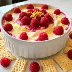 - 8 oz cream cheese - 1 cup powdered sugar - 1/2 cup sour cream - 1 tablespoon fresh lemon juice - Zest of 1 lemon - 1 teaspoon pure vanilla extract - 1 cup fresh raspberries When making Lemon Raspberry Cheesecake Dip, the ingredients are simple yet key. First, cream cheese gives the dip its rich and creamy base. I always use 8 oz, softened to room temp. This helps create a smooth texture. Next, I mix in 1 cup of powdered sugar. This adds sweetness and balances the tang from the lemon. For creaminess, I add 1/2 cup of sour cream. It makes the dip light and fluffy. The fresh lemon juice is a must. Just 1 tablespoon adds a bright tang. I also include the zest of 1 lemon for extra flavor. The zest makes the dip smell amazing and taste fresh. Finally, I add 1 teaspoon of pure vanilla extract. This deepens the flavor and complements the lemon and raspberry. Speaking of raspberries, I use 1 cup of fresh ones. They add color and a burst of juicy flavor. Make sure to save a few for garnish! - Graham crackers - Vanilla wafers - Fruit garnishes When it comes to serving, I like to keep it fun and easy. Graham crackers and vanilla wafers are perfect for dipping. They add a crunchy texture that pairs well with the creamy dip. I also love to decorate the dip with fresh fruit garnishes. Slices of lemon and extra raspberries make the dish pop. Not only does it look good, but it also invites guests to dig in. Enjoy this delightful and simple treat! - Step 1: Beat cream cheese Start by taking your softened cream cheese. Place it in a medium bowl. Use an electric mixer on medium speed. Beat for about 2-3 minutes until it is smooth and creamy. - Step 2: Incorporate powdered sugar Gradually add the sifted powdered sugar into the bowl. Mix on low speed until it is well combined. This step helps avoid lumps in your dip. - Step 3: Add remaining ingredients Now, add the sour cream, fresh lemon juice, lemon zest, and vanilla extract. Mix on medium speed again for 1-2 minutes. You want everything to blend well and become fluffy. - Step 4: Fold in raspberries Take fresh raspberries and carefully fold them into the mixture. Use a spatula for this. Keep some whole berries for texture and flavor bursts. - Step 5: Transfer and garnish Transfer the dip to a decorative serving bowl. Smooth the top with your spatula for a clean look. Garnish with extra raspberries and a sprinkle of lemon zest. - Presentation ideas Serve this dip in a colorful bowl at the center of a platter. This will catch everyone’s eye. - Creating a vibrant platter Surround the bowl with graham crackers or vanilla wafers. Scatter fresh lemon slices and extra raspberries around for color. - Suggested dippers Graham crackers and vanilla wafers make great dippers. You can also use fresh fruit for a fun twist! - Alternative sweeteners: You can use honey, agave, or maple syrup instead of powdered sugar. These options add unique flavors and can be healthier. - Non-dairy options: If you want a dairy-free dip, use vegan cream cheese and coconut yogurt. This keeps the creamy texture and flavor. - Different berry varieties: Feel free to swap raspberries with strawberries, blueberries, or blackberries. Each berry brings its own flavor, making it fun to mix things up. - Additional flavorings: Try adding a splash of almond extract or a hint of cinnamon for warmth. These flavors can elevate the dip and surprise your taste buds. - Tips on achieving fluffiness: Make sure your cream cheese is at room temperature. This helps it mix smoothly and become fluffy when blended. - Achieving the best texture: Fold in the raspberries gently to keep some whole. This adds bites of fruit that make every dip special. {{image_4}} You can make Lemon Raspberry Cheesecake Dip even more fun by adding flavors. - Adding chocolate: Mix in some cocoa powder or melted chocolate. This gives the dip a rich, sweet twist. Try dark chocolate for a bold taste or white chocolate for creaminess. - Mixing in other fruits: You can swap or add fruits. Try strawberries, blueberries, or peaches. Each fruit brings its own flavor, making the dip unique. - Infusing with herbs: For a fresh taste, add herbs like mint or basil. Just a little can change the flavor. It adds a fun surprise to your dip! You can also adjust this dip to fit different diets. - Gluten-free dippers: Use gluten-free graham crackers or rice cakes. They pair well and keep the dip safe for those avoiding gluten. - Vegan adaptations: Replace cream cheese with a vegan option made from cashews or tofu. Use maple syrup instead of powdered sugar for sweetness. - Low-sugar options: Try using a sugar substitute like stevia or monk fruit. These keep the dip sweet without the added sugar. To keep your Lemon Raspberry Cheesecake Dip fresh, store it in the fridge. Use an airtight container to prevent air from changing its texture. Make sure to cover it well. If you want to freeze it, put it in a freezer-safe container. Leave some space at the top for expansion as it freezes. This dip stays fresh for about 3 to 5 days in the fridge. Check for signs of spoilage. If it smells sour or has a strange color, throw it away. If you freeze it, it can last for about 2 months. However, the texture may change when thawed. Always taste a small amount before serving. How do I make this dip ahead of time? You can make this dip a day before serving. Just follow the steps and store it in the fridge. Cover it with plastic wrap to keep it fresh. Before serving, stir gently to make it smooth again. Can I use frozen raspberries? Yes, you can use frozen raspberries. Just thaw them and drain any excess juice. This helps keep the dip from getting watery. Fresh raspberries add a nice texture, but frozen ones work well too. What can I serve with Lemon Raspberry Cheesecake Dip? Serve this dip with graham crackers or vanilla wafers. You can also add fresh fruits like apple slices or strawberries. These add color and taste to your platter. My dip is too runny, what to do? If your dip is too runny, check if you added too much sour cream or lemon juice. You can add more cream cheese to thicken it. Mix in a little at a time until it reaches the right texture. How can I thicken the dip? To thicken the dip, add more cream cheese. You can also use a bit of powdered sugar. Mix well until the dip is thick and creamy. What’s the best way to store leftovers? Store leftovers in an airtight container in the fridge. This keeps it fresh for up to three days. Before serving again, stir the dip to bring back its smoothness. This blog post covered how to make a delicious Lemon Raspberry Cheesecake Dip. You learned the key ingredients, step-by-step instructions, and serving tips. We explored tips for flavor, ingredient swaps, and variations to try. You now have solid ways to store this dip and answers to common questions. Enjoy creating this treat! Your friends and family will love it. Try different flavors and serving ideas for fun. Happy dipping!