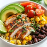 - 2 boneless, skinless chicken breasts - 2 tablespoons Cajun seasoning - 1 tablespoon olive oil - 1 cup quinoa, thoroughly rinsed - 2 cups vegetable broth (or water) - 1 red bell pepper, diced - 1 cup black beans, drained and rinsed - 1 cup corn (fresh or frozen) - 1 ripe avocado, sliced - 1 cup cherry tomatoes, halved - 1/4 cup fresh cilantro, finely chopped - 1 lime, cut into wedges - Salt and pepper to taste For the Cajun Chicken Power Bowl, you need fresh, quality ingredients. The chicken breasts are the stars here. Choose ones that are plump and firm. Cajun seasoning brings the heat and flavor that makes this dish special. I use a good olive oil for cooking. It adds richness and helps the spices stick to the chicken. Quinoa is a great base. It’s packed with protein and gives you a nice texture. Rinse it well to remove its natural coating. This helps it cook better and taste great. The vegetable broth adds depth. You can use water, but broth gives it a richer flavor. Now for the veggies. I love the crunch of red bell pepper. Black beans provide protein and fiber. Corn adds a sweet touch, and I prefer fresh if I can find it. The avocado gives creaminess, while the cherry tomatoes add freshness. The finishing touch is cilantro. It brightens up the bowl. Serve with lime wedges for that zesty kick. Use salt and pepper to season to your taste. Each ingredient plays a role in this flavorful and filling meal. {{ingredient_image_2}} To start, take your chicken breasts and place them in a bowl. Drizzle olive oil over the chicken. Next, sprinkle Cajun seasoning evenly on both sides. Make sure each piece is well coated. Marinate the chicken for at least 15 minutes. This time helps the flavors soak in and makes it taste amazing. In a medium saucepan, combine the rinsed quinoa and vegetable broth. Set the pot over medium heat. Once it boils, turn the heat down low, cover it, and let it simmer. Cook for about 15 minutes. You know the quinoa is done when it looks fluffy and the liquid is gone. Fluff the quinoa gently with a fork to keep it light. Heat a skillet over medium heat. If needed, add a bit more olive oil. Place the marinated chicken breasts in the skillet. Cook each side for about 6-7 minutes. Use a meat thermometer to check that the chicken reaches 165°F (75°C). Once cooked, move the chicken to a cutting board and let it rest for a few minutes before slicing. In the same skillet, add diced red bell pepper, black beans, and corn. Sauté these for about 3-4 minutes. Stir them occasionally until the bell pepper is tender but still crisp. Season with salt and pepper to boost the flavor. This step adds color and texture to your bowl. Grab a large bowl and start with a base layer of fluffy quinoa. Next, layer on the sautéed veggies, sliced Cajun chicken, halved cherry tomatoes, and avocado slices. Arrange everything nicely for a great look. Each layer brings its own color and flavor to the dish. Finish your bowl by sprinkling chopped cilantro on top. Serve with lime wedges on the side. The lime adds a fresh zing when you squeeze it over the bowl. This dish not only looks good but tastes even better, making it a hit for any meal! Marinating chicken makes it taste better. I suggest using olive oil and Cajun seasoning. Let the chicken sit for 15 minutes. This helps the flavors soak in. Before you slice the chicken, let it rest for a few minutes. This keeps the juices inside. If you skip this step, your chicken may end up dry. Rinse quinoa well before cooking. This removes the bitter coating called saponin. Use cold water and a fine mesh strainer for the best results. To enhance quinoa flavor, try cooking it in vegetable broth instead of water. You can also add a pinch of salt or herbs while cooking. For a beautiful bowl, use a large white bowl. This color makes the food pop. Arrange the ingredients in sections for a neat look. Add a few lime wedges around the bowl. This not only looks good but lets guests add fresh juice, enhancing the dish's flavor. Pro Tips Marinate for More Flavor: Let the chicken marinate for at least 30 minutes if you have time. This will infuse the meat with deeper flavors from the Cajun seasoning. Perfectly Fluffy Quinoa: Make sure to rinse the quinoa thoroughly before cooking to remove any bitterness. This step ensures a light and fluffy texture. Customizable Veggies: Feel free to swap in your favorite vegetables. Zucchini, spinach, or even roasted sweet potatoes make great additions to the power bowl. Fresh Lime Juice: Squeezing fresh lime juice over the assembled bowl just before serving adds a refreshing zing that enhances all the flavors. {{image_4}} You can switch the chicken for many other proteins. Try shrimp or fish for a lighter option. Tofu works well if you want a vegetarian choice. Tempeh is another great vegan protein source. It has a nice texture and absorbs flavors well. Quinoa is great, but you can use other grains too. Brown rice or farro adds a hearty touch. Couscous cooks quickly and is very easy to prepare. Just follow the package directions for cooking times. You can also use barley for a nutty flavor. Seasoning can change the whole dish. Try adding smoked paprika for a deeper flavor. You can use garlic powder or onion powder for extra taste. Mix in more veggies like zucchini or spinach for added nutrition. For toppings, consider feta cheese or a dollop of sour cream. To keep your Cajun Chicken Power Bowl fresh, store leftovers in airtight containers. Refrigerate them within two hours of cooking. This will help keep the flavors intact. You can store the chicken, quinoa, and veggies together or separately. If you want to freeze your bowl, let it cool first. Then, pack it in freezer-safe bags or containers. This way, you can enjoy it later. When it’s time to eat, reheating is key for good texture. For the chicken, the best way is in a skillet over medium heat. This keeps the chicken juicy. If you’re reheating quinoa and veggies, use a microwave. Add a splash of water to prevent drying out. Heat in short bursts and stir occasionally. This helps everything warm evenly. Leftovers can stay fresh in the fridge for 3 to 4 days. If frozen, eat within 3 months for the best taste. Watch for signs of spoilage. If you see mold or a strange smell, throw it out. Always trust your senses when checking food freshness. A Cajun Chicken Power Bowl is a hearty dish. It combines seasoned chicken, quinoa, and fresh veggies. This bowl bursts with flavor and color. The Cajun seasoning adds a spicy kick. It’s a perfect balance of protein, grains, and veggies. Yes, you can prepare this dish ahead of time. Cook the chicken and quinoa in advance. Store them in airtight containers in the fridge. You can also chop the veggies earlier. Just add them when you are ready to serve. This recipe is quite healthy. It includes lean chicken, quinoa, and fresh vegetables. Quinoa provides protein and fiber. Beans and veggies add vitamins and minerals. This meal is filling and offers good nutrition. You can easily customize this bowl. If you prefer a different protein, try shrimp or tofu. For grains, use brown rice or farro. Change the vegetables based on your taste. Add cheese or nuts for extra flavor. Serve the bowl with a side salad or steamed veggies. You can also pair it with crusty bread. A refreshing drink like iced tea works well. Try a light beer for a casual meal. This blog post covered all you need to know for a Cajun Chicken Power Bowl. We listed ingredients, detailed cooking steps, and provided storage tips. You can make this meal fresh or ahead of time for easy meals. Remember, you can customize the bowl with different proteins or grains. Enjoy putting your twist on this flavorful dish. With these tips, you’ll create a satisfying meal that looks and tastes great. Dive in and make your Cajun Chicken Power Bowl today!
