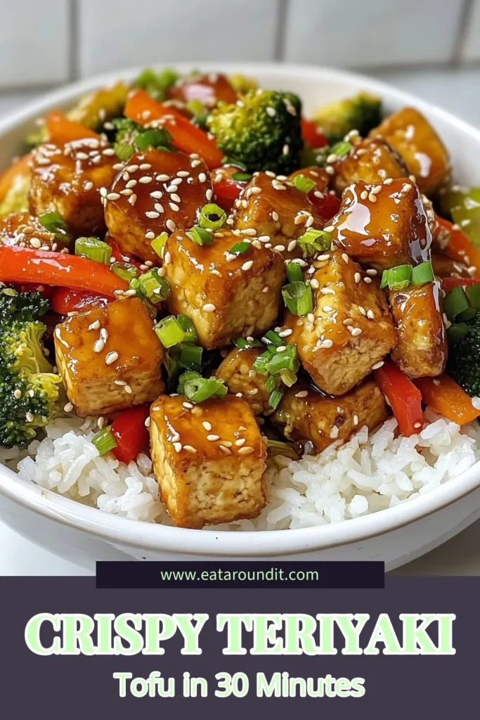 Elevate your dinner with this crispy teriyaki tofu stir fry! This easy tofu dish features perfectly crispy teriyaki tofu combined with fresh vegetables, all drenched in a healthy teriyaki sauce recipe. Perfect for quick, delicious meals, this vegan stir fry recipe is a must-try! Don't miss out on the chance to make a healthier dinner that everyone will love. Save this recipe today! #CrispyTeriyakiTofu #VeganStirFry #HealthyRecipes #TofuDishes
