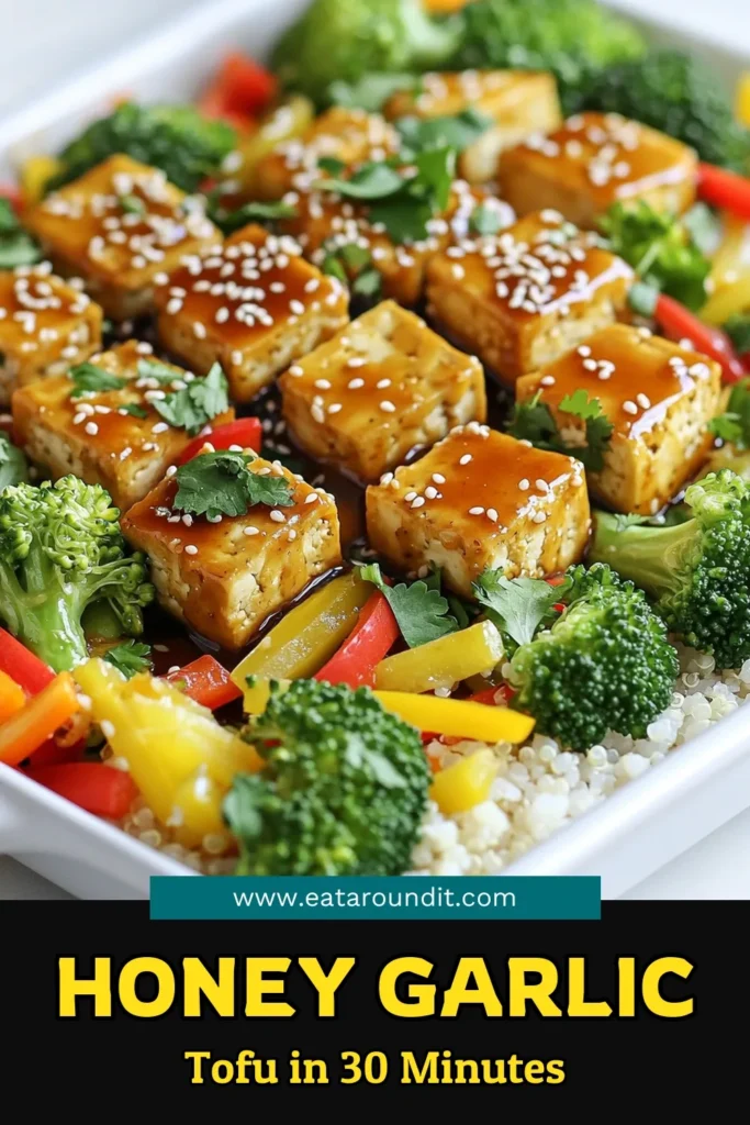 Elevate your dinner game with this Sheet Pan Honey Garlic Tofu Delight! Ready in just 45 minutes, this tasty recipe features marinated tofu and colorful veggies, all roasted to perfection. It's a quick, healthy meal that everyone will love, and you can easily make it vegan! Click through for the full recipe and impress your family tonight. Don’t forget to save this for later! #TofuRecipes #SheetPanMeals #HealthyEating #VeganDinner