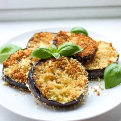 To make Parmesan crusted eggplant, gather these simple ingredients: - 2 medium eggplants, sliced into ½ inch rounds - 1 cup panko breadcrumbs - 1 cup freshly grated Parmesan cheese - 2 large eggs, beaten - 1 cup all-purpose flour - 2 teaspoons garlic powder - 1 teaspoon dried oregano - ½ teaspoon black pepper - ½ teaspoon salt - Olive oil spray or 2 tablespoons extra virgin olive oil - Fresh basil leaves for garnish You can add extra flavor with these optional ingredients: - Red pepper flakes for some heat - Lemon zest for a fresh taste - Fresh herbs like thyme or parsley If you need substitutes, here are some ideas: - Use almond flour instead of all-purpose flour for a gluten-free option. - Swap panko with regular breadcrumbs if that's what you have. - Grated Pecorino Romano cheese can replace Parmesan for a different taste. - Egg replacer can work if you want a vegan version. These choices help you customize the dish to your taste or what you have on hand. Enjoy experimenting! {{ingredient_image_2}} First, you need to preheat your oven to 400°F (200°C). This temperature gives the eggplant a nice, crispy texture. While the oven heats up, line a baking sheet with parchment paper. This step prevents sticking and makes cleanup easier. Now, let’s create a breading station. You will need three shallow dishes. In the first dish, place one cup of all-purpose flour. This helps the eggplant to hold onto the egg. In the second dish, beat two large eggs. The eggs will help the breadcrumbs stick. In the third dish, mix one cup of panko breadcrumbs with one cup of grated Parmesan cheese, two teaspoons of garlic powder, one teaspoon of dried oregano, half a teaspoon of black pepper, and half a teaspoon of salt. Stir it well to ensure it is mixed evenly. Take a sliced eggplant round and dip it into the flour. Make sure to coat it well, then shake off extra flour. Next, dip the floured eggplant into the beaten eggs. Let any excess egg drip back into the dish. Now, press the eggplant slice into the breadcrumb mixture. Make sure it is fully coated. Press gently to help it stick. Repeat this for all the eggplant slices. Lay the coated eggplant rounds on the baking sheet in a single layer. If you want extra flavor, drizzle olive oil on top or use olive oil spray. Place the baking sheet in the oven and bake for 20-25 minutes. Remember to turn the eggplant slices halfway through. This helps them brown evenly. Once they are golden and crispy, take them out and let them cool for a few minutes. This cooling time helps the crust set. Enjoy your delicious Parmesan crusted eggplant! To get that perfect crunch, follow a few simple steps. Use panko breadcrumbs; they provide amazing texture. Make sure to coat each eggplant slice well with flour first. This helps the egg stick better. Dip it in the beaten eggs next. Finally, press it into the breadcrumb mix. A good press makes sure every slice gets a nice layer. Bake at 400°F (200°C) and flip halfway through. This way, both sides get golden and crispy. Store any leftovers in an airtight container. They will stay fresh for about three days. When you want to reheat them, use your oven if possible. Preheat it to 350°F (175°C) and bake for about 10 minutes. This keeps the crust crunchy. You can also use an air fryer for quick reheating. Just set it to 350°F (175°C) for 5 minutes. Avoid the microwave; it can make the eggplant soggy. Feel free to mix up the flavors! You can add spices to the breadcrumb mix, like paprika or cayenne for heat. Try swapping half the Parmesan for mozzarella for a gooey twist. For an herb boost, add fresh parsley or thyme to the mix. You can even layer on marinara sauce before baking for an Italian flair. These little tweaks can make your dish unique and fun! Pro Tips Choose the Right Eggplant: Look for firm, shiny eggplants with smooth skin. Avoid any that have soft spots or blemishes, as they may be overripe. Seasoning Matters: Feel free to experiment with additional spices in the breadcrumb mixture, such as smoked paprika or Italian seasoning, for an extra flavor boost. Don’t Overcrowd the Baking Sheet: Ensure the eggplant rounds are spaced apart on the baking sheet. This allows hot air to circulate and achieve maximum crispiness. Serve Immediately: For the best texture, serve the Parmesan crusted eggplant right out of the oven while they are still warm and crispy. {{image_4}} Dipping sauces make Parmesan crusted eggplant even better. You can use marinara sauce for a classic touch. A spicy aioli adds a kick that many enjoy. For a fresh option, try a yogurt or tzatziki sauce. These sauces add flavor and moisture. They enhance the crunch of the eggplant. Experiment with different sauces to find your favorite! A vibrant garnish can elevate your dish. Fresh basil leaves add color and flavor. Sprinkle some chopped parsley for a fresh look. You can also add a drizzle of balsamic glaze. This adds a sweet and tangy touch. For a bit of heat, add red pepper flakes on top. A beautiful presentation makes the dish inviting and exciting. Pair your eggplant with simple sides. A light salad with lemon vinaigrette complements its flavors. Roasted vegetables like zucchini or bell peppers work well too. You can serve it with quinoa or rice for a filling meal. Garlic bread is another great option for a hearty dinner. These sides balance the meal and keep it fresh and tasty. You can swap out Parmesan cheese for other cheeses. Mozzarella gives a nice stretch. Cheddar adds a sharp taste. You might even try feta for a tangy kick. Each cheese changes the flavor, making the dish your own. Panko breadcrumbs are great for crunch, but they are not the only choice. You can use regular breadcrumbs, seasoned breadcrumbs, or even crushed crackers. Each type gives a different texture and taste. Experiment to find your favorite! Want to boost nutrition? Add more veggies! Zucchini or bell peppers work well with eggplant. Slice them thin like the eggplant. Coat them the same way with the breading mixture. This creates a colorful and tasty veggie medley. Enjoy the added flavors and health benefits! Yes, you can prep the eggplant in advance. After breading, place the slices on a baking sheet and cover them with plastic wrap. Keep them in the fridge for up to 24 hours. When you're ready, just bake them as directed. This saves time on busy days and lets flavors marinate. The eggplant is done when it turns a golden brown color. You should hear a nice crunch when you tap it. Use a fork to check if it's soft inside. If it feels tender and has a crisp crust, it's ready to eat! Parmesan crusted eggplant pairs well with many dishes. You can serve it with marinara sauce for dipping. A fresh salad adds nice balance. For heartier meals, try it with grilled chicken or pasta. You can even layer it in a sandwich! This recipe is not gluten-free as it uses all-purpose flour and panko breadcrumbs. To make it gluten-free, use gluten-free flour and gluten-free breadcrumbs. Many brands offer tasty options that still deliver a great crunch. In this blog post, I covered everything about making Parmesan crusted eggplant. You learned the key ingredients, how to prepare and bake, and tips to enhance flavor and crunch. I highlighted serving suggestions and variations to make it your own. With these steps, you can create a delicious dish. Experiment with flavors and enjoy every bite. Cooking should be fun, so make it your own!