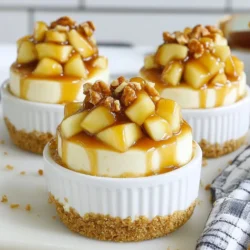 To make Apple Pie Cheesecake Cups, you need fresh and simple ingredients. Here’s what you'll need: - 2 cups graham cracker crumbs - 1/2 cup unsalted butter, melted - 1/4 cup granulated sugar - 2 packages (8 oz each) cream cheese, softened - 1 cup powdered sugar - 1 teaspoon pure vanilla extract - 2 cups whipped cream (store-bought or homemade) - 2 large Granny Smith apples, peeled and diced - 1 teaspoon ground cinnamon - 1/2 teaspoon ground nutmeg - 1 tablespoon fresh lemon juice - Optional: Caramel sauce for drizzling - Optional: Chopped walnuts for garnish These ingredients create rich flavors and textures. The graham cracker crust gives a nice crunch. The cream cheese filling is creamy and smooth. The apples add a fresh taste, spiced with cinnamon and nutmeg. You can drizzle caramel and sprinkle walnuts for extra fun. Each ingredient plays a key role in making these cups a delightful treat. {{ingredient_image_2}} To make the crust, combine these ingredients in a bowl: - 2 cups graham cracker crumbs - 1/2 cup unsalted butter, melted - 1/4 cup granulated sugar Mix well until it feels like wet sand. You want it crumbly but not dry. Tip: Press the mixture firmly into the bottom of your cups. This gives your crust strength. Ensure it is even and compact. In a new bowl, beat together: - 2 packages (8 oz each) cream cheese, softened - 1 cup powdered sugar - 1 teaspoon pure vanilla extract Use an electric mixer to make it smooth and creamy. No lumps should remain. Next, gently fold in 2 cups of whipped cream. This keeps your filling light and fluffy. For the apple filling, chop 2 large Granny Smith apples into small pieces. In a medium saucepan over medium heat, mix the apples with: - 1 teaspoon ground cinnamon - 1/2 teaspoon ground nutmeg - 1 tablespoon fresh lemon juice Cook for about 5-7 minutes. You want the apples tender but still a bit firm. Stir often to avoid burning. Start by spooning a layer of cheesecake filling into each cup. Use the back of a spoon to smooth it out. Then, add a layer of the cooked apple filling. Repeat the layers until the cups are full. Make sure the top layer is cheesecake filling for that pretty look. Cover each cup with plastic wrap and place them in the fridge for at least 2 hours. This helps the flavors blend well and sets the filling. When ready to serve, drizzle with caramel sauce and sprinkle chopped walnuts on top. This adds a nice crunch and looks great too. - Over-mixing the cream cheese: Mix just until smooth. Too much mixing can make it runny. - Not compacting the crust enough: Pack the crust tightly. A weak crust won’t hold its shape. - Adding spices for extra flavor: Try adding more cinnamon or a pinch of ginger. This adds warmth and depth. - Alternative toppings or sweeteners: Use honey or maple syrup instead of sugar. Top with fresh fruit for added color. - Recommended mixing tools and bowls: Use a sturdy mixing bowl and a hand mixer for best results. A silicone spatula helps fold in whipped cream. - Best cups or jars for serving: Choose clear cups or jars. This shows off the beautiful layers of your dessert. Pro Tips Use Cold Ingredients: For a creamier cheesecake filling, ensure that your cream cheese is at room temperature but your whipped cream is cold. This balance helps maintain a light texture. Layering Technique: When assembling the cups, be gentle when layering the apple mixture on top of the cheesecake filling to avoid mixing the layers. This will create a beautiful visual contrast. Chill Longer for Best Results: If time allows, chill the cheesecake cups longer than two hours. This will enhance the flavors and allow the filling to set more firmly. Customize Your Apples: While Granny Smith apples are tart and perfect for this recipe, feel free to mix in other varieties like Honeycrisp or Fuji for added sweetness and complexity. {{image_4}} You can use many fruits for these cheesecake cups. Granny Smith apples are great, but try Fuji or Honeycrisp for a sweeter taste. You can even mix different apples for more flavor. Seasonal fruits also work well, like pears in fall or berries in summer. For holidays, think about adding cranberries for a festive twist. If you need gluten-free options, use almond flour or gluten-free graham crackers for the crust. For the filling, swap cream cheese with a dairy-free cream cheese. You can also use coconut cream for a lighter taste. These swaps keep the dessert tasty while meeting dietary needs. Want to get creative? Try pumpkin spice cheesecake cups in fall. Add pumpkin puree and spices like ginger and cloves to the filling. For the winter holidays, add peppermint extract to the cheesecake. You can even top it with crushed candy canes for a festive look. These twists keep your dessert exciting and fun for every occasion. To keep your apple pie cheesecake cups fresh, store them in the fridge. Use an airtight container or cover each cup with plastic wrap. This helps prevent them from drying out. Make sure to place them on a flat surface so they don’t spill. Your cheesecake cups will stay good for about 3 to 5 days. The flavor remains rich and delicious if stored properly. Yes, you can freeze apple pie cheesecake cups! This makes them a great make-ahead dessert. To freeze, place each cup in a freezer-safe container or wrap them well with plastic wrap. They can last up to 2 months in the freezer. When you’re ready to enjoy them, take them out and thaw them in the fridge overnight. This slow thaw helps keep the texture nice. Serve the cups cold and top them with caramel sauce or nuts right before serving. Enjoy the delightful flavors anytime! Yes, you can. I recommend making them a day before. This gives the flavors time to blend. Just be sure to cover them well in the fridge. They taste even better after chilling overnight. Look for a firm texture at the edges. The center might still jiggle a bit. Once they feel cool to the touch, they are ready to serve. If you press gently, they should hold their shape. No, you don’t have to. Other apples like Honeycrisp or Fuji can work well. They will change the flavor, making it sweeter or less tart. Choose apples based on your taste preference. Yes, you can. Store-bought crust saves time and effort. However, homemade crust is fresher and tastier. If you choose store-bought, make sure it fits well in your cups. You can use coconut cream or almond milk. These options are great for dairy-free diets. If you want a lighter choice, use half-and-half instead. Each option will slightly alter the taste and texture. You can create delicious apple pie cheesecake cups by following these steps. Start with a tasty graham cracker crust, mix up a smooth cheesecake filling, and cook your apple filling just right. Layer everything beautifully, chill, and serve for the best texture. Remember, pay attention to common mistakes, and feel free to try new flavors. With so many variations, you can make these cups your own and enjoy any season. Store them carefully and enjoy well-prepared bites at any time!